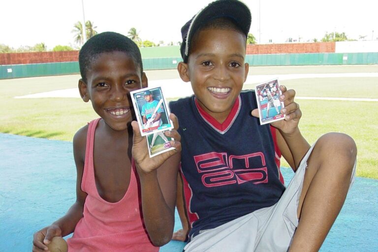 Children Brandish Baseball Cards at Stadium
