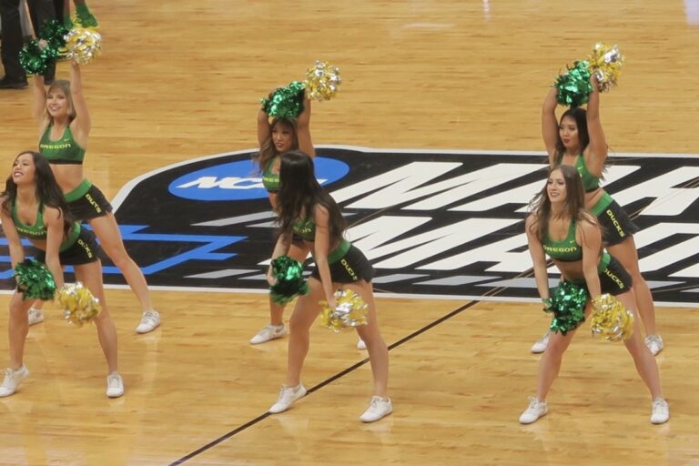 March Madness logo centre court with cheerleaders