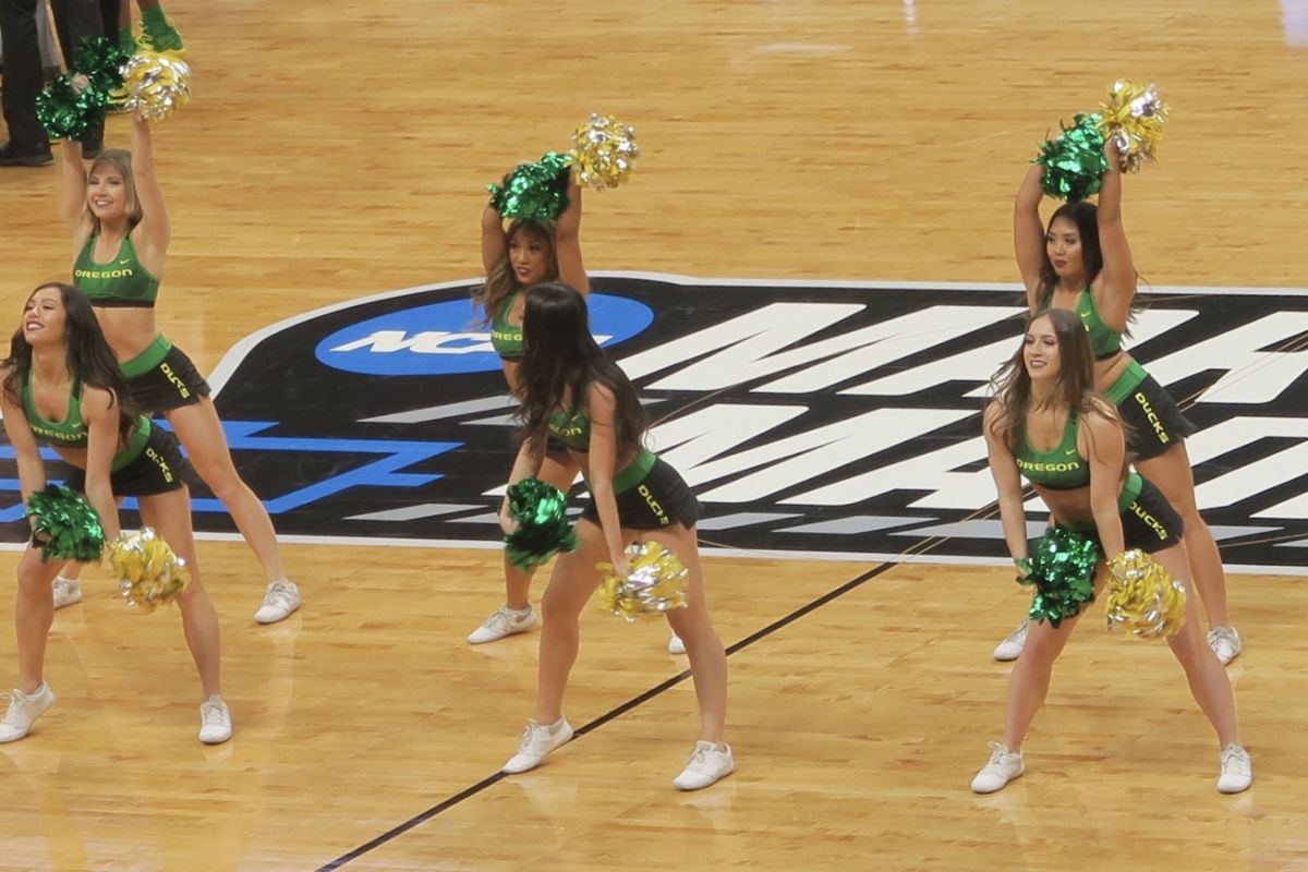March Madness logo centre court with cheerleaders