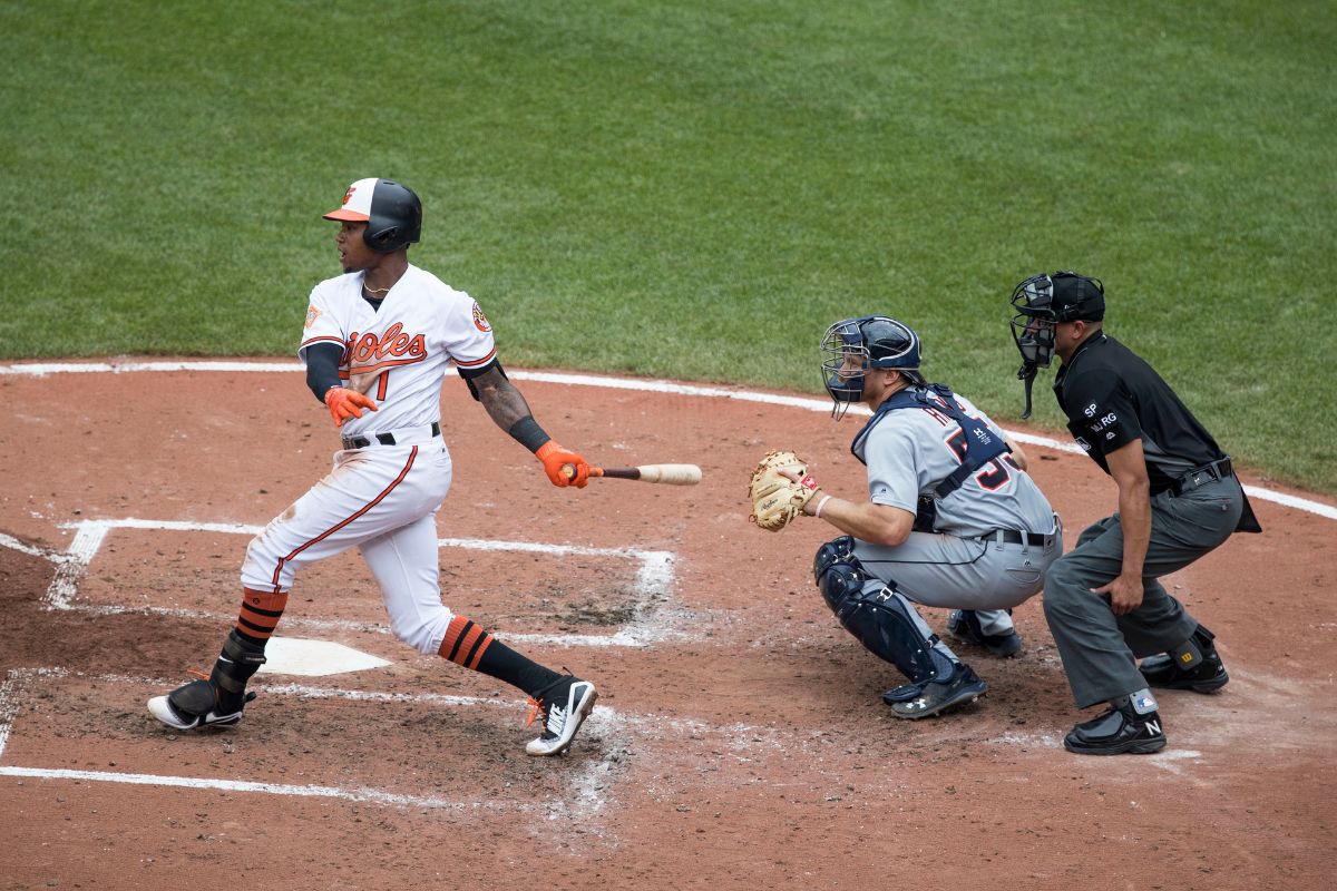 Tim Beckham, catcher John Hicks, umpire Roberto Ortiz