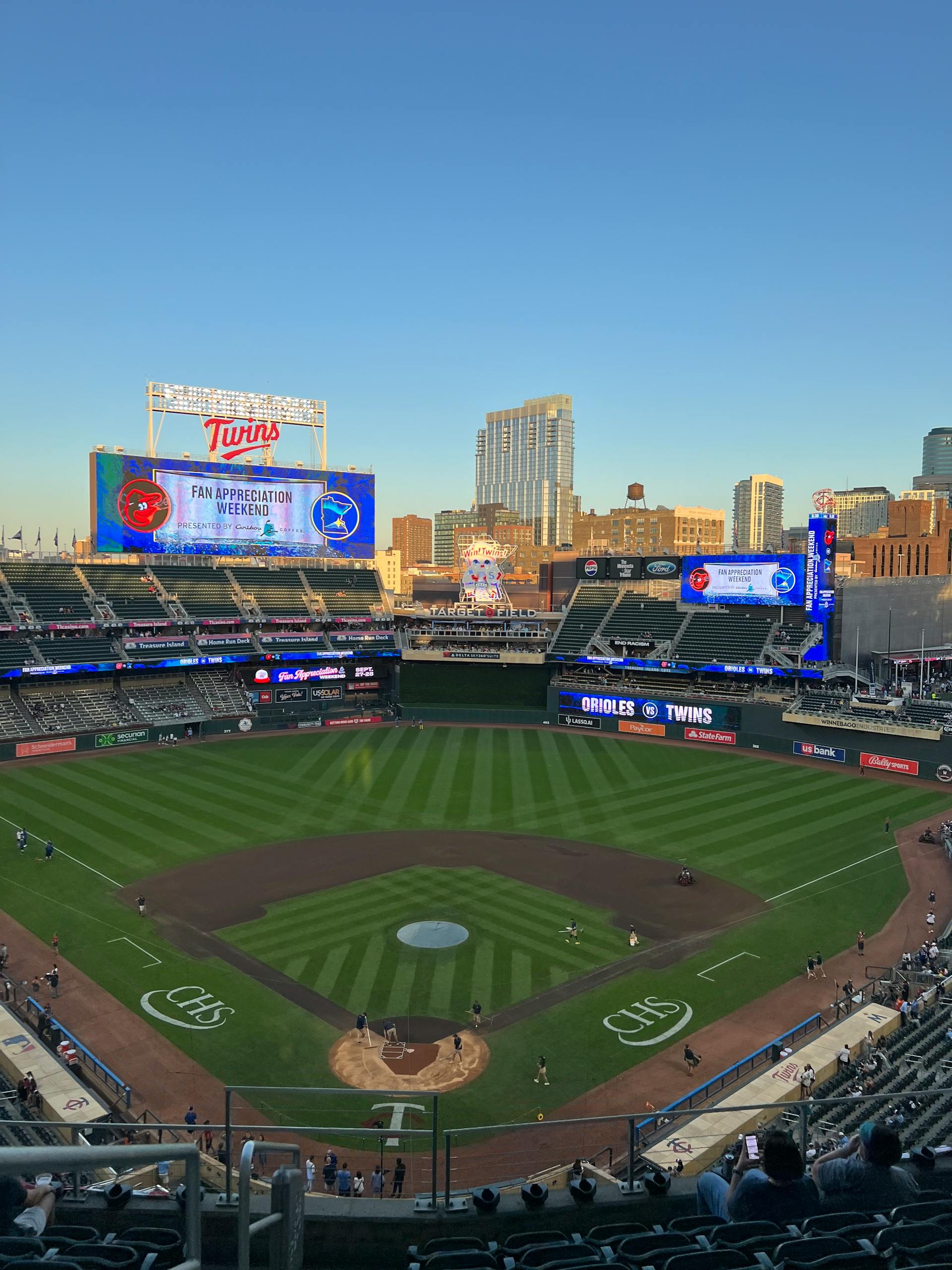 A vibrant evening view of Target Field hosting a baseball game in summer.