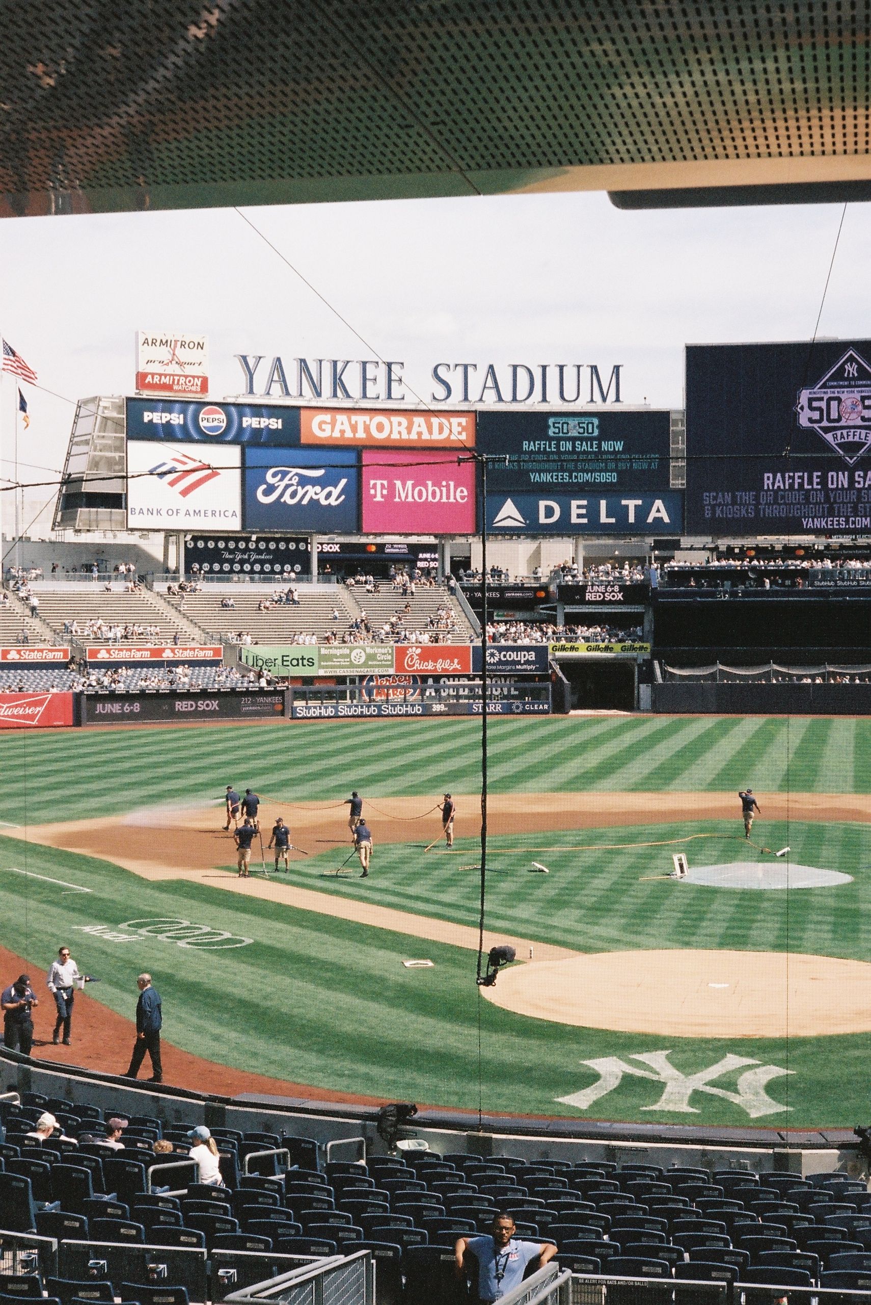 A view of Yankee Stadium's baseball field during the day, capturing the infield and outfield.