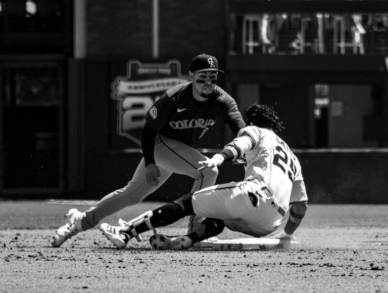 Dynamic black and white photo capturing baseball action in San Francisco.