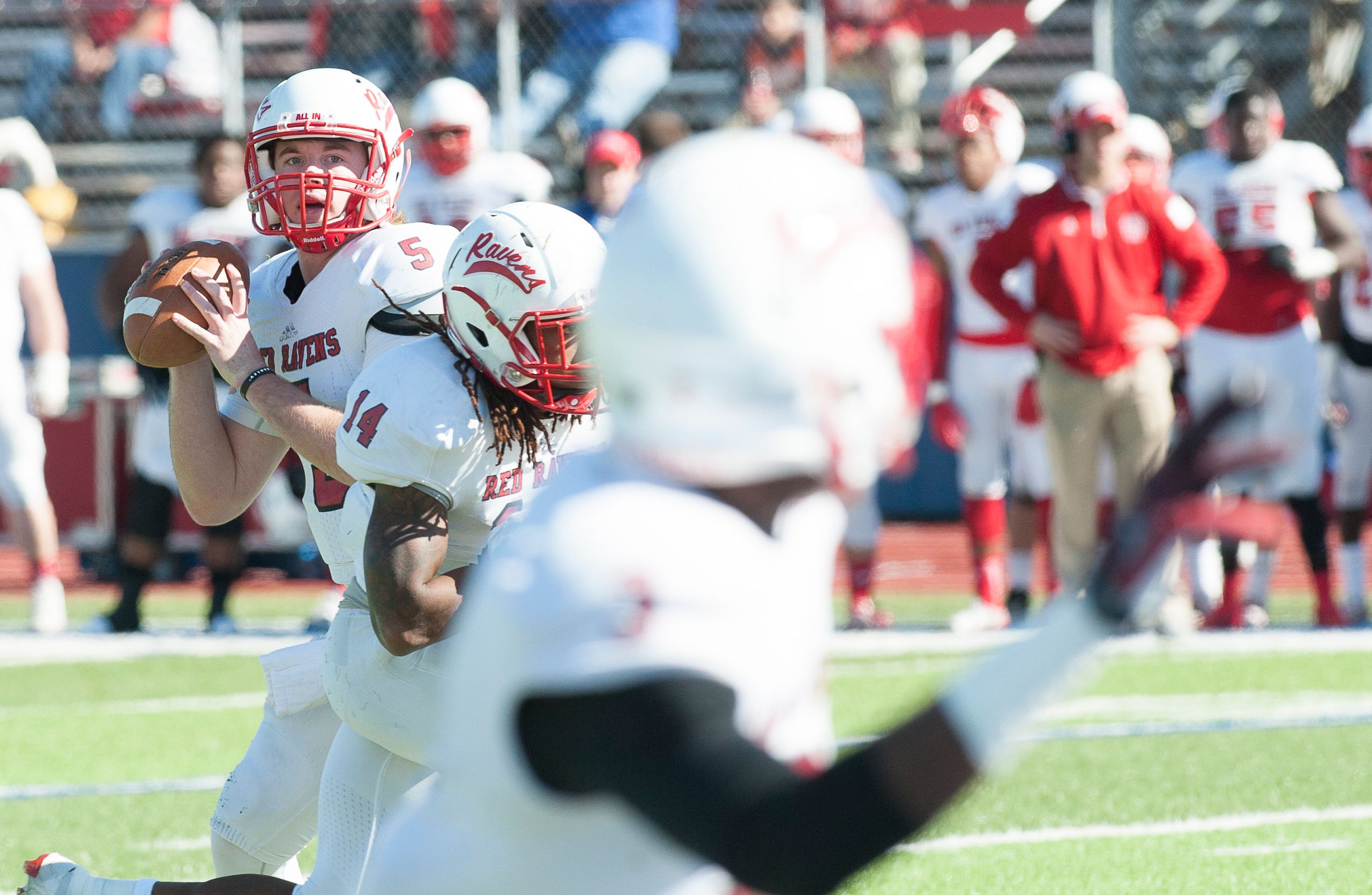 Football players on the field captured in action during a lively game.