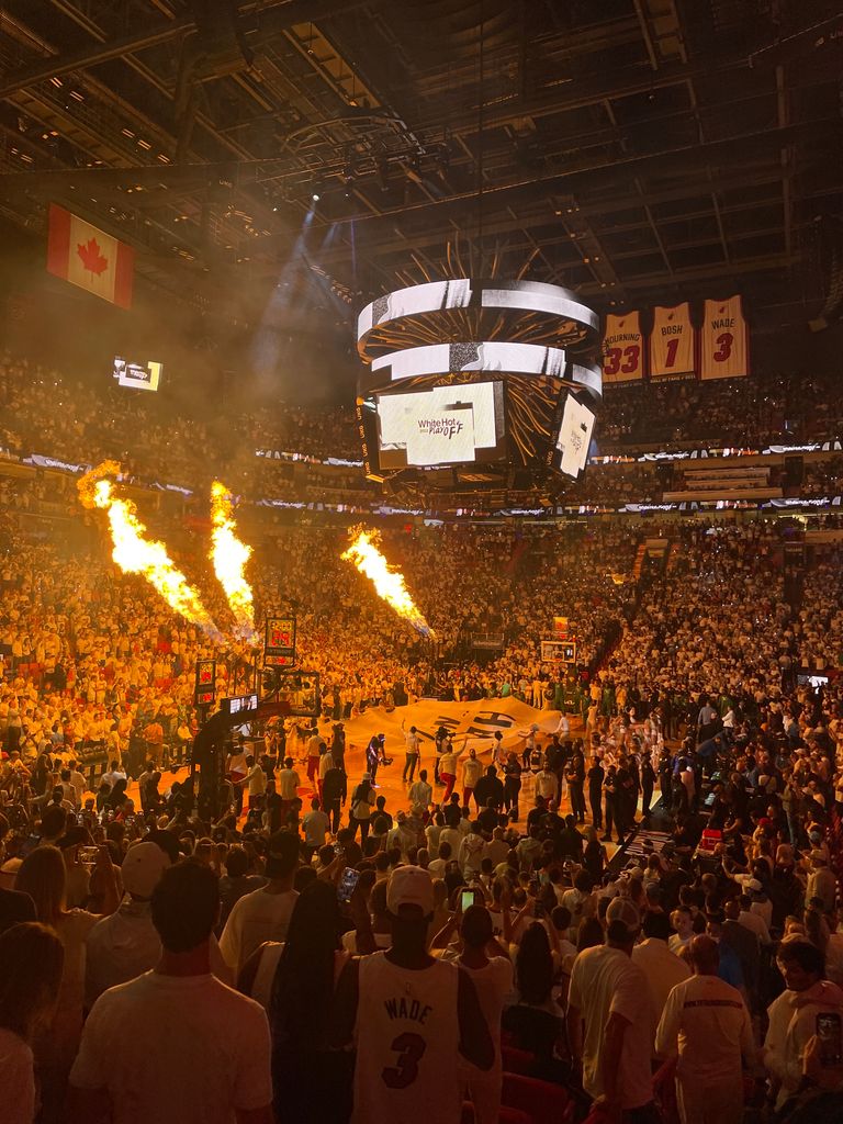 High-energy Miami Heat basketball game with a packed stadium and fiery pre-game show.