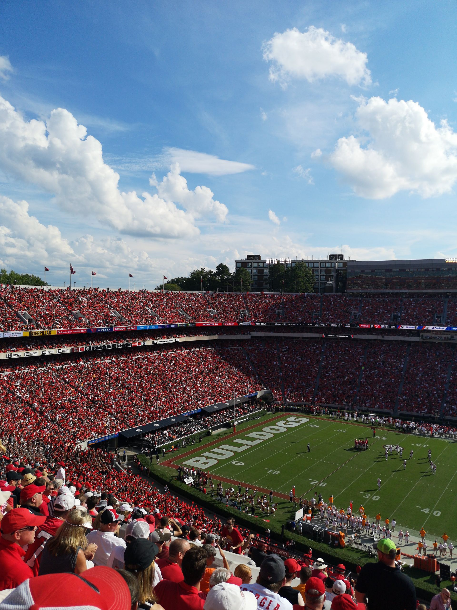 A vibrant college football game at a packed stadium in Athens, GA, USA. Great crowd atmosphere.