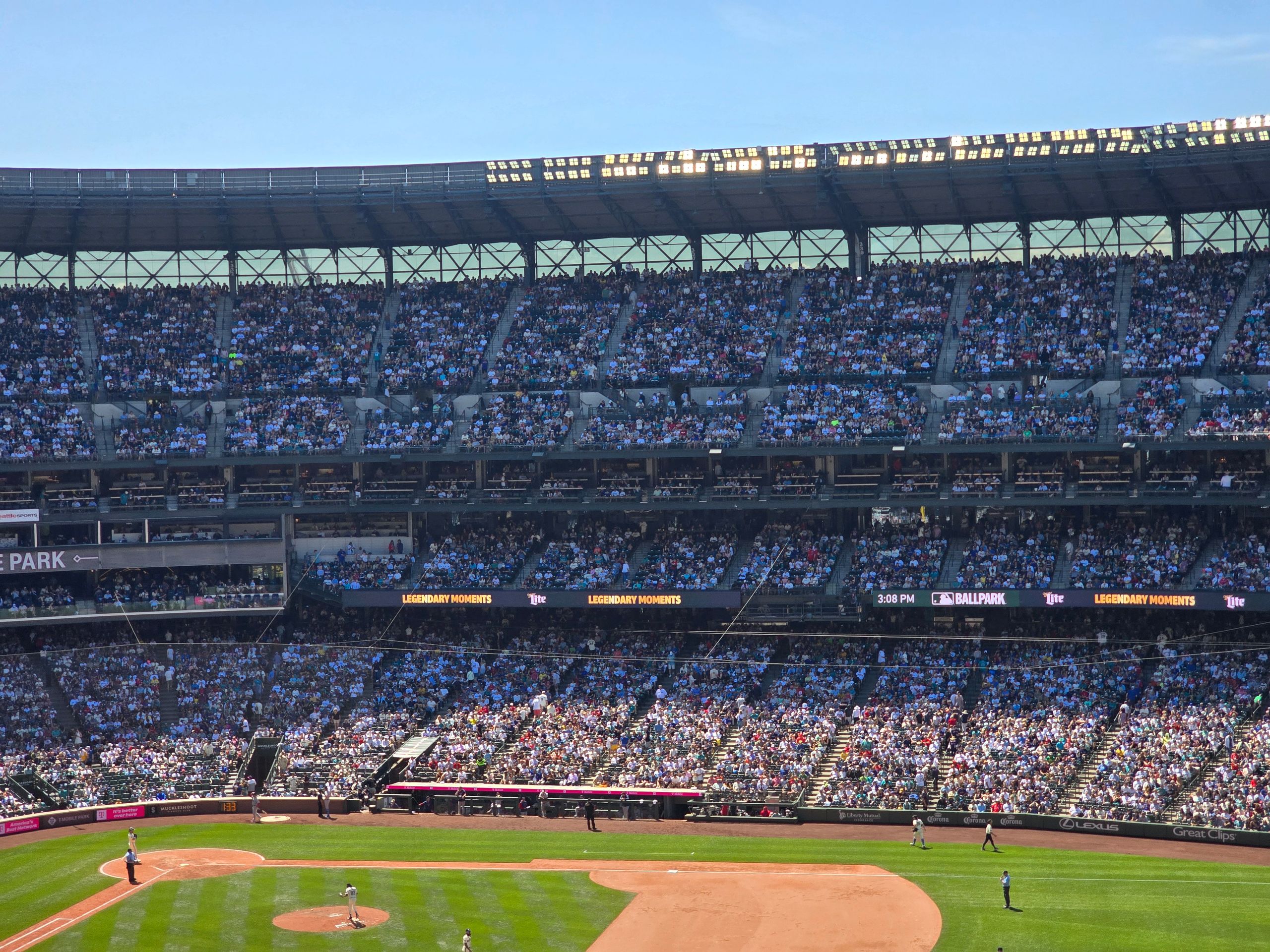Crowded baseball stadium scene during a sunny day at T-Mobile Park, Seattle.