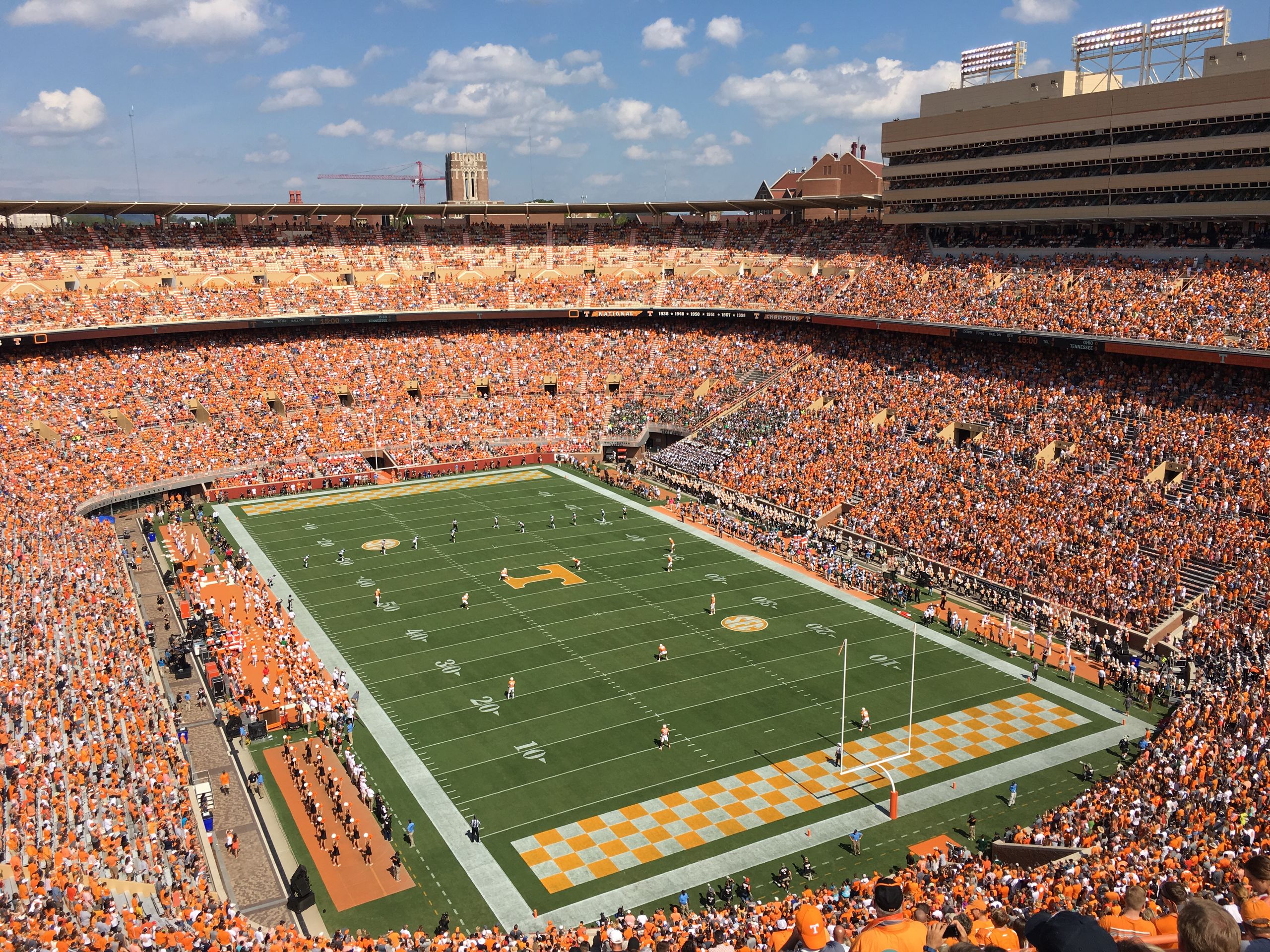 Vibrant scene at Knoxville's football stadium showcasing a lively game from an aerial perspective.