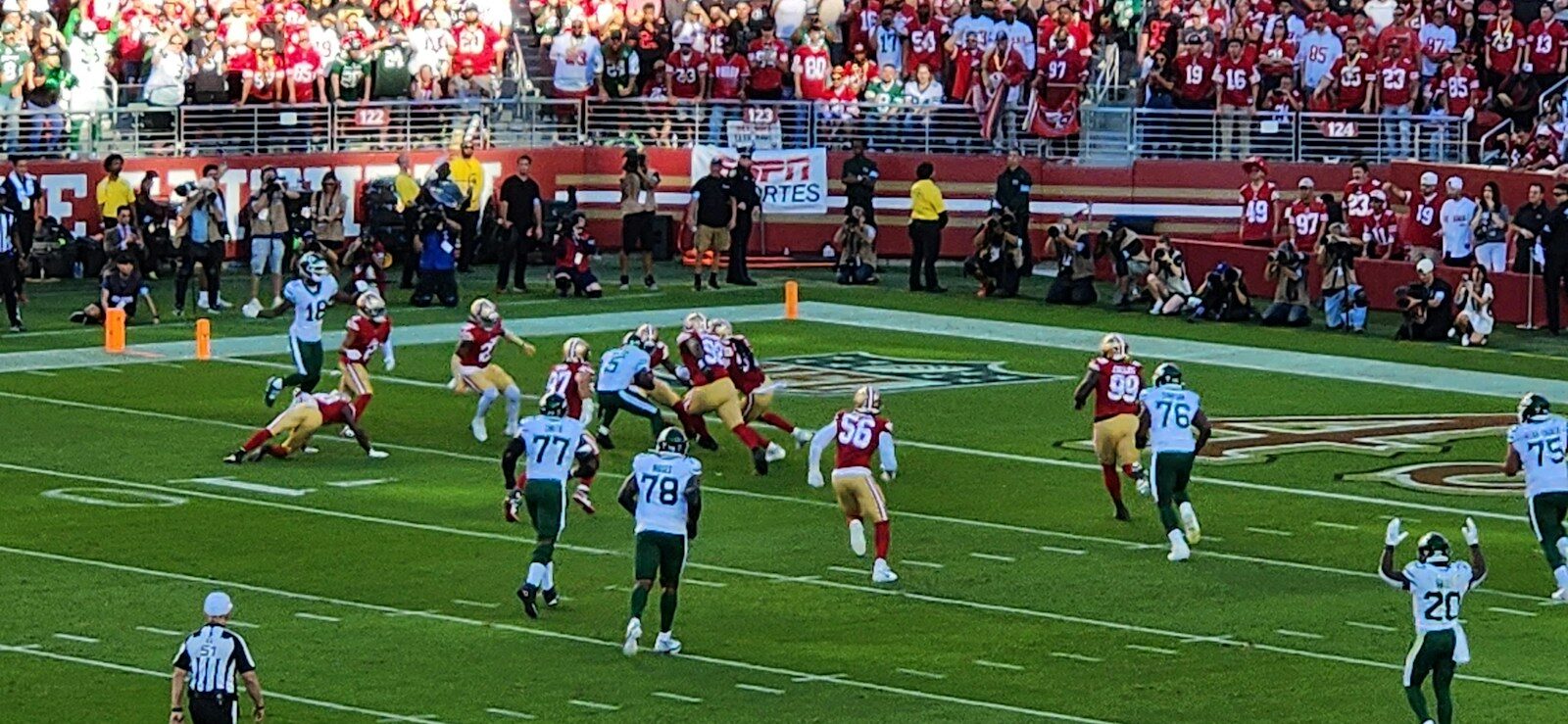 A football game is being played in a stadium