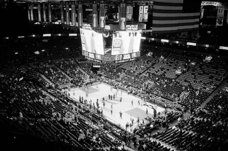 Basketball game in a packed arena at night